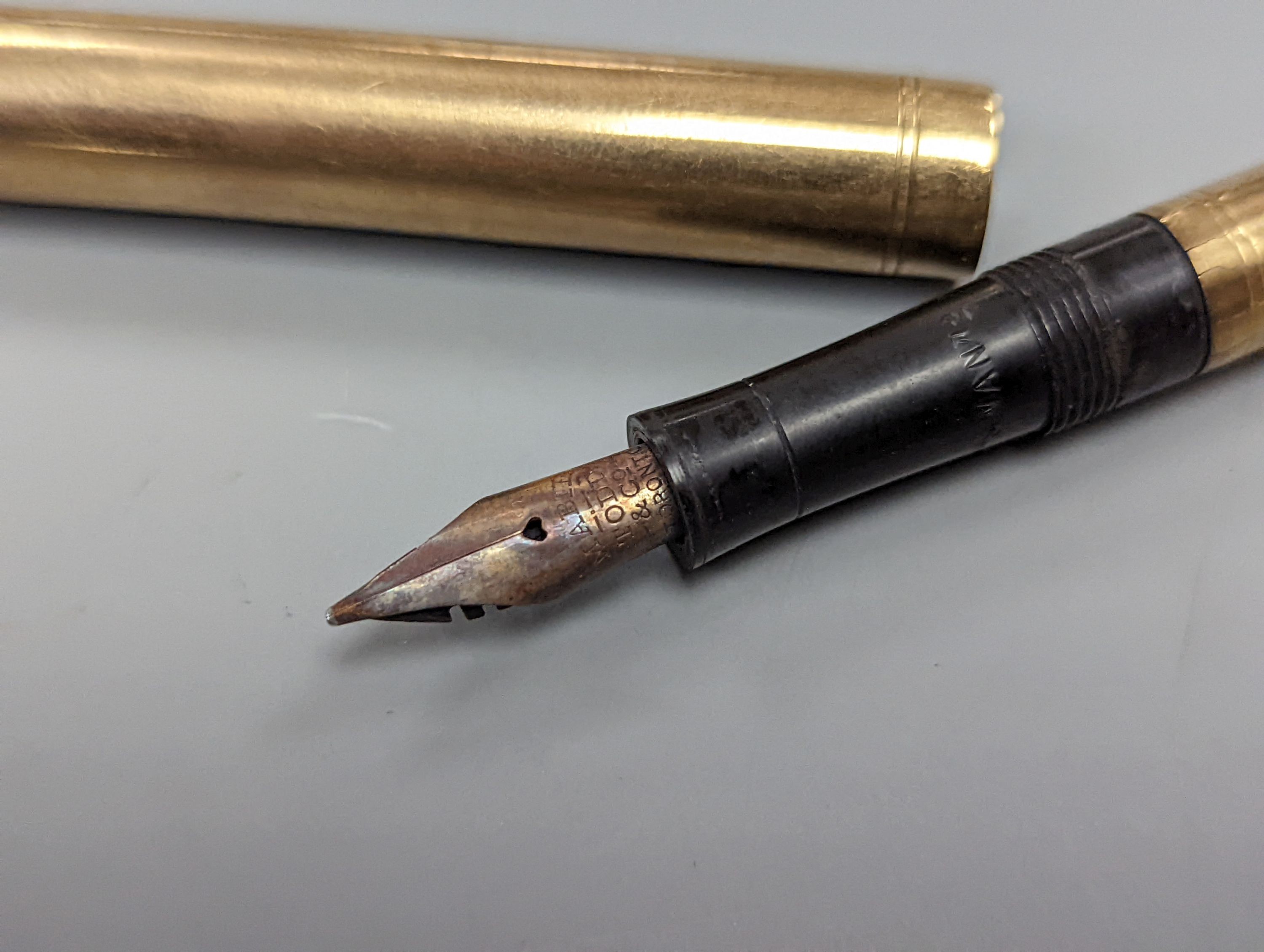 A 9ct gold “swan pen” pen engraved ‘BRIG. GENERAL. J.W. WALKER. IRVINE’